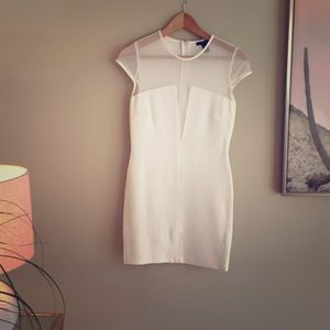 Size M white mini with sheer lining, never worn.